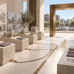 Architectural proposals on stone plinths with converging paths leading through a bronze selection gate toward a completed real estate development